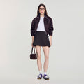Mini pleated wool skirt